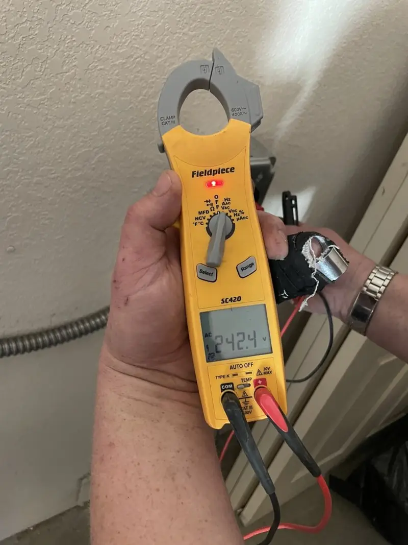 Voltage testing with clamp meter during Outlet Installation in Bridgewater